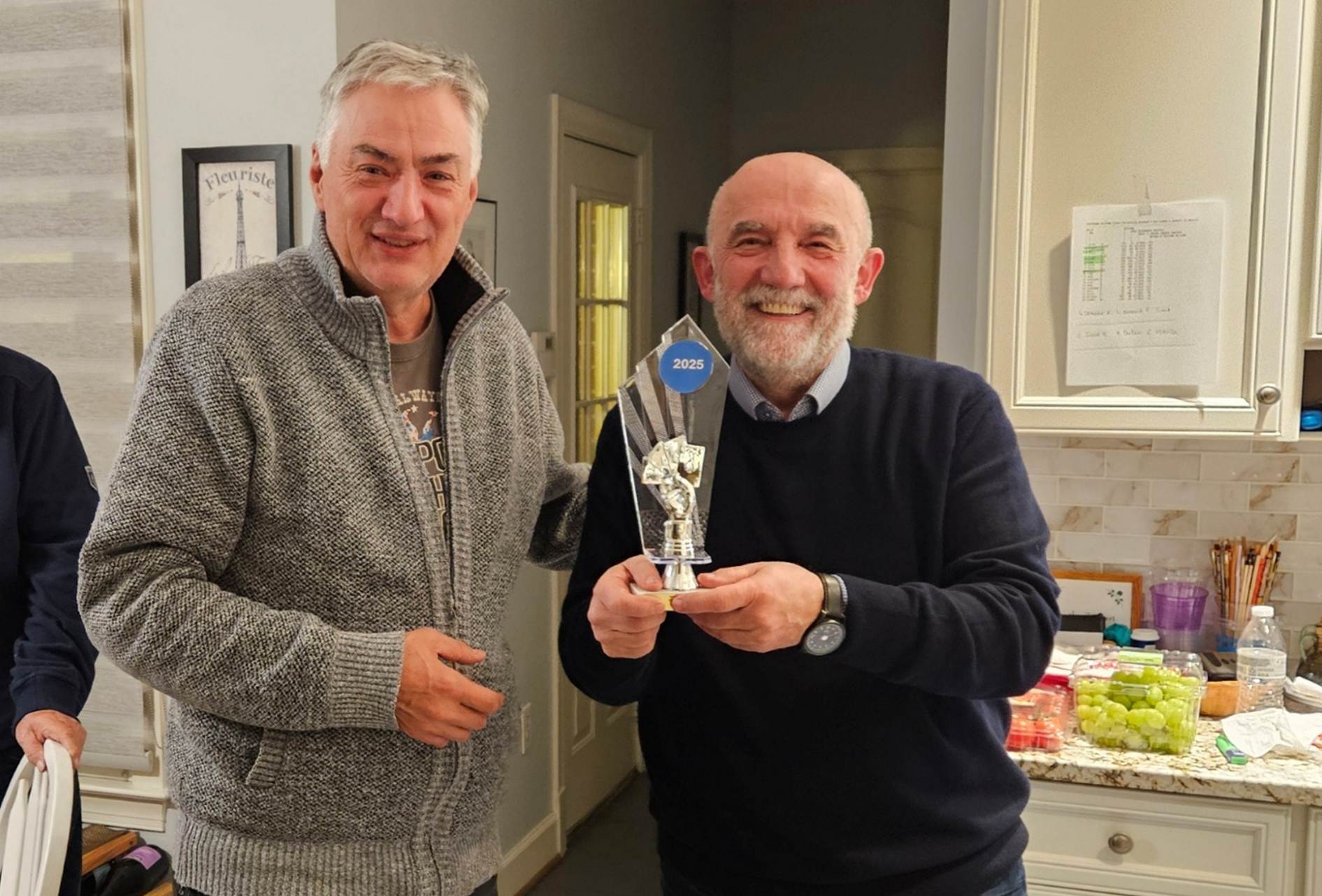 A group of men standing in a kitchen

AI-generated content may be incorrect.